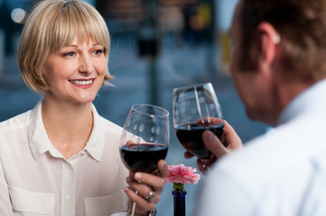 Couple toasting wine glasses