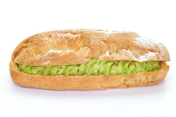 Fresh eclairs filled with green tea cream