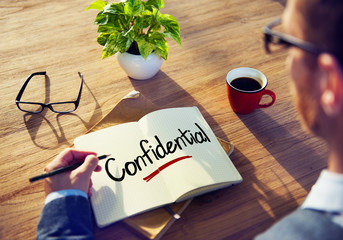 Man with a Note and a Single Word Confidential