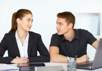 Businesspeople sitting at table