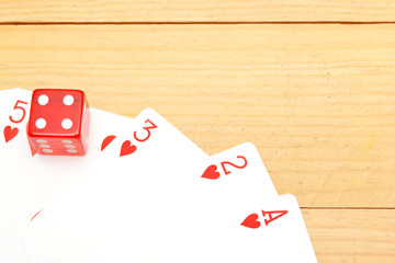 Poker cards with red dice