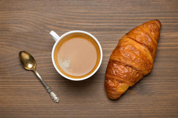 cup of espresso, croissant, concept photo, top view
