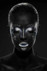 black girl with eyes closed and beautiful make-up