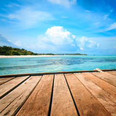 Jetty, beach and jungle - vacation background