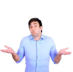 Portrait of confused clueless young man against white background - obrazy, fototapety, plakaty
