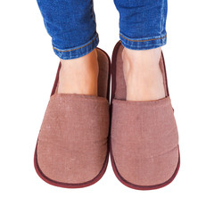 hotel slipper and foot on white background