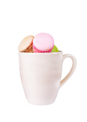 traditional french colorful sweet Macaron in cup on white backgr