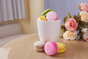 Fototapeta na wymiar traditional french colorful sweet Macaron in cup
