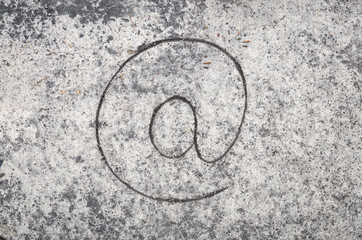 mail icon on sand background
