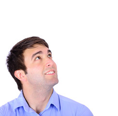 Obraz premium Portrait of happy handsome young man looking up isolated on whi