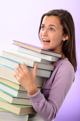 Shocked student girl carry stack of books