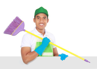 Portrait of young man ready to do some cleaning. presenting copy