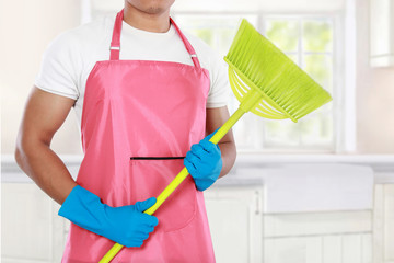 man's body with broom cleaning equipment