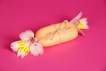 Piece of the new soap attached by twine and flower