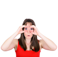 Portrait of young woman looking through imaginary binoculars iso