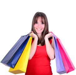 Fototapeta na wymiar Young beautiful shopping woman on sale holding many colorful sho