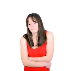 Young woman with stomach pains in studio with white background