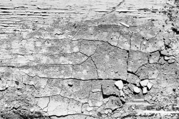 Dry rough cracked texture in black and white