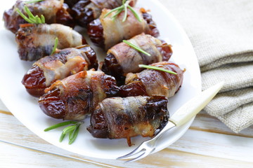 appetizer delicacy dates wrapped in bacon and fried