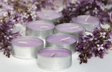 Obraz na płótnie Canvas Scented candles with the scent of lilacs.