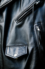 high contrast black leather biker jacket detail