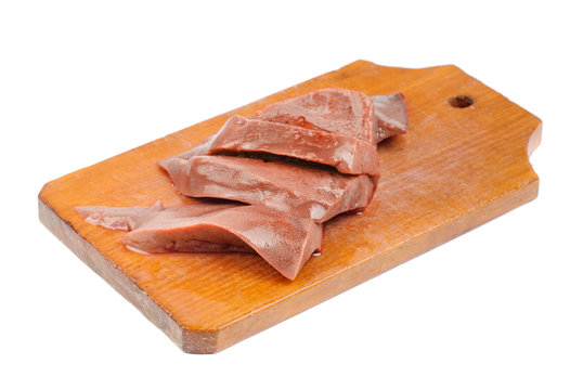 Fresh raw pork liver on the board