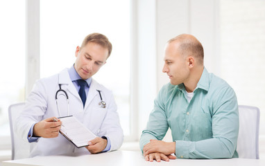 doctor with clipboard and patient in hospital