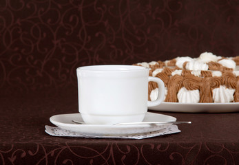 Gateau, cup, saucer and spoon