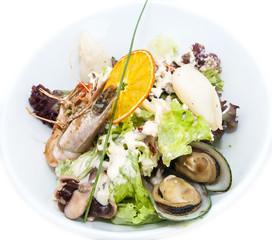 salad with seafood in a restaurant on a white background