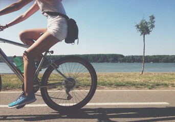 Riding bicycle by the river