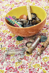 thread,button,crochet hook, and other sewing tools