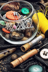thread,button,crochet hook, and other sewing tools