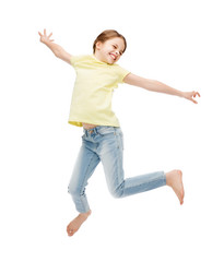 smiling little girl jumping