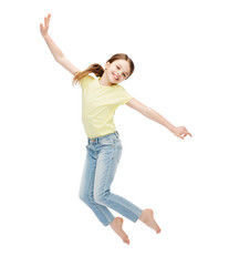 smiling little girl jumping