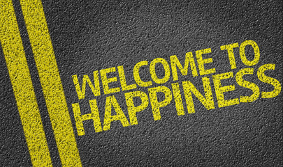 Welcome to Happiness written on the road