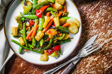 Baked vegetables on rustic background