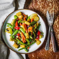 Baked vegetables on rustic background
