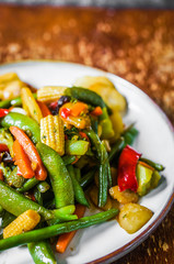 Baked vegetables on rustic background