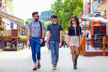 stylish friends walking the city street