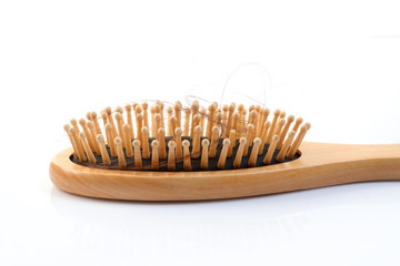 Wooden comb brush with lost hair