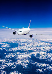 Fototapeta na wymiar Airplane over the clouds