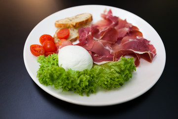 plate of meat with mozzarella