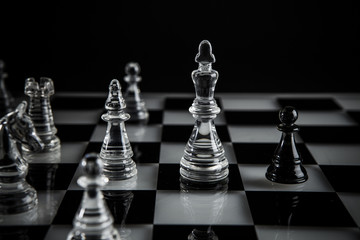 chess pieces on a glass board