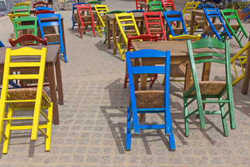 Fototapeta na wymiar street cafe chairs tables colors