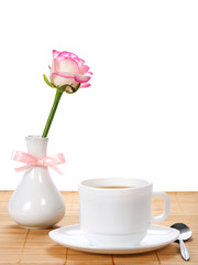 Rose in vase with, tea-things