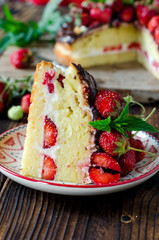 Sponge cake with cream, strawberries and chocolate