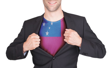 Businessman opening suit to reveal shirt with flag