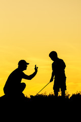 Obraz premium Golf sunset silhouette