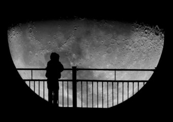 Silhouette of a child staring at the Moon. Science education. © marcel