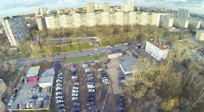 Cars on parking in residential district of city.